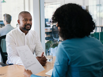 Photo of two people having a meeting