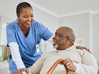 Photo of a medical assistant helping a male