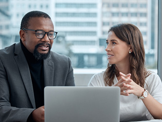 Photo of two people having a meeting