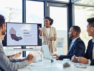 Female employee speaking at a meeting